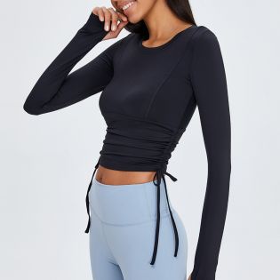 Black long-sleeved yoga jacket with adjustable drawstrings on both sides to easily change the look and tie it up to show the curve of the waist.